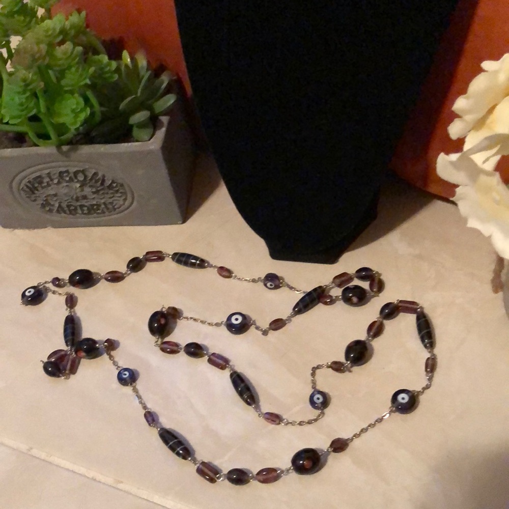 Long varied size beaded glass stone chain in dark purplish brown color
